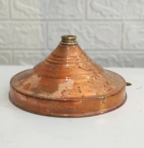 Shiny copper wall rack after removing tarnish